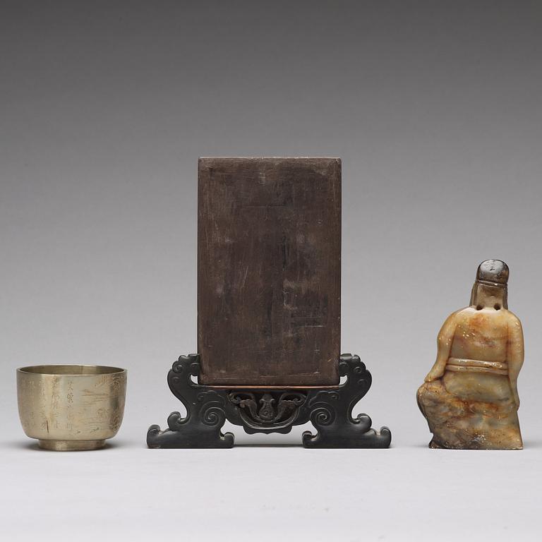 A stone placque, a soapstone figure and a cup, late Qing dynasty.