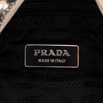 Prada, a tweed and leather bag.