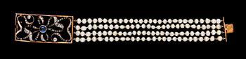 720. A four strand natural pearl bracelet with diamond and sapphire clasp.