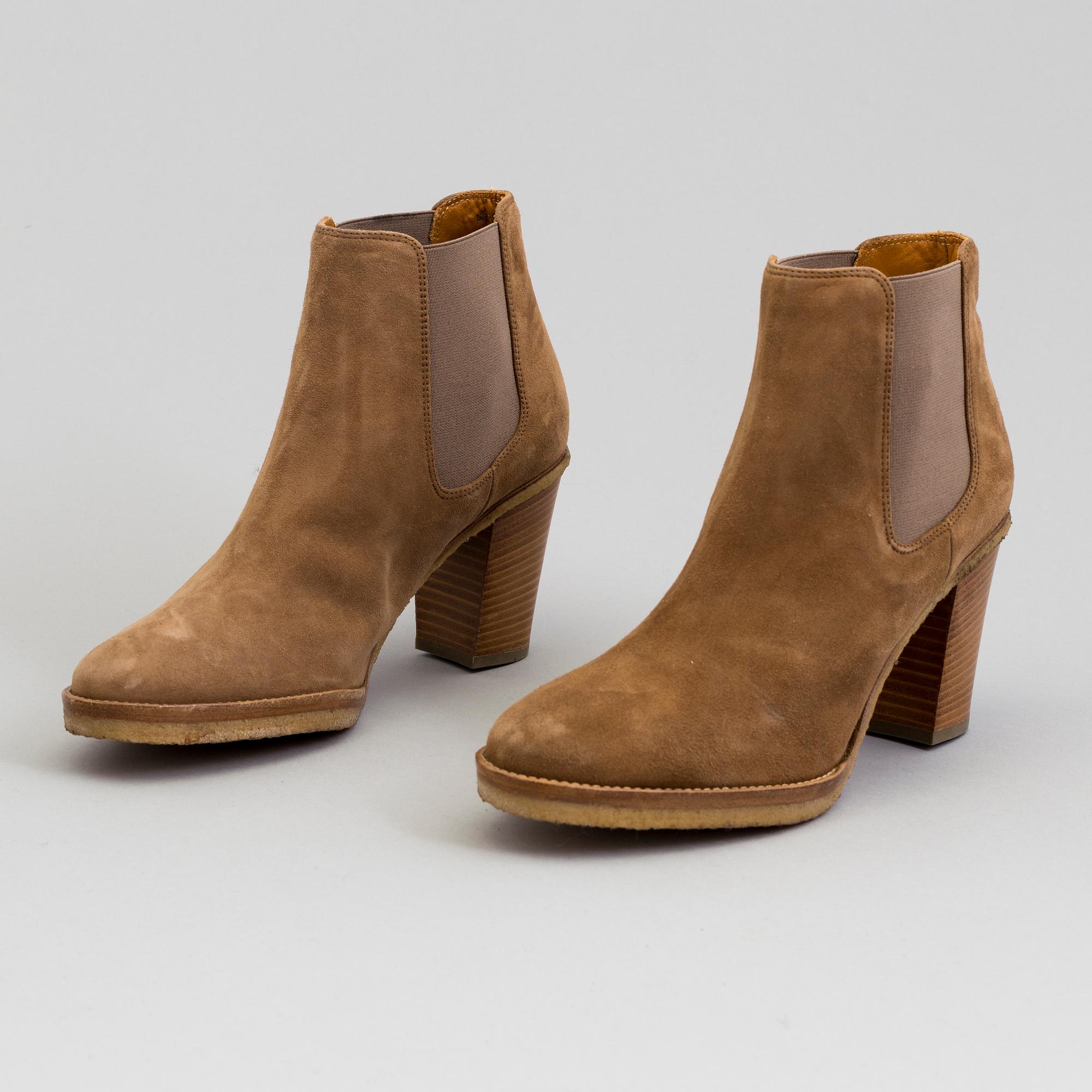 A pair of suede bootie byRalph Lauren.
