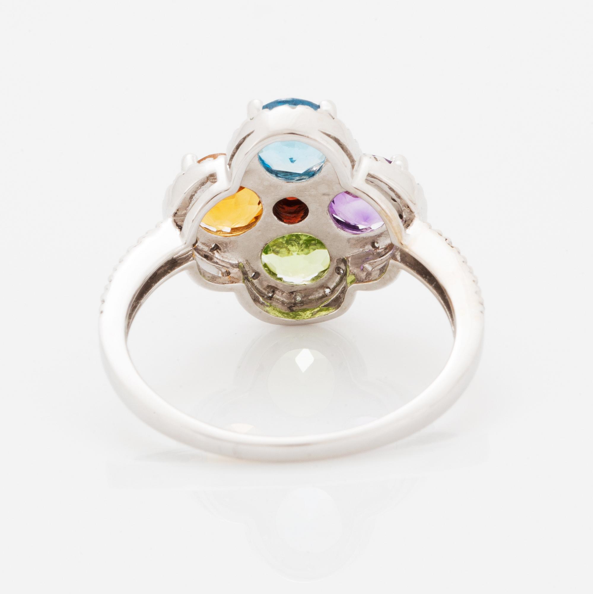 Ring, med fasettslipad topas, ametist, peridot, citrin och briljantslipade diamanter i form av blomma.