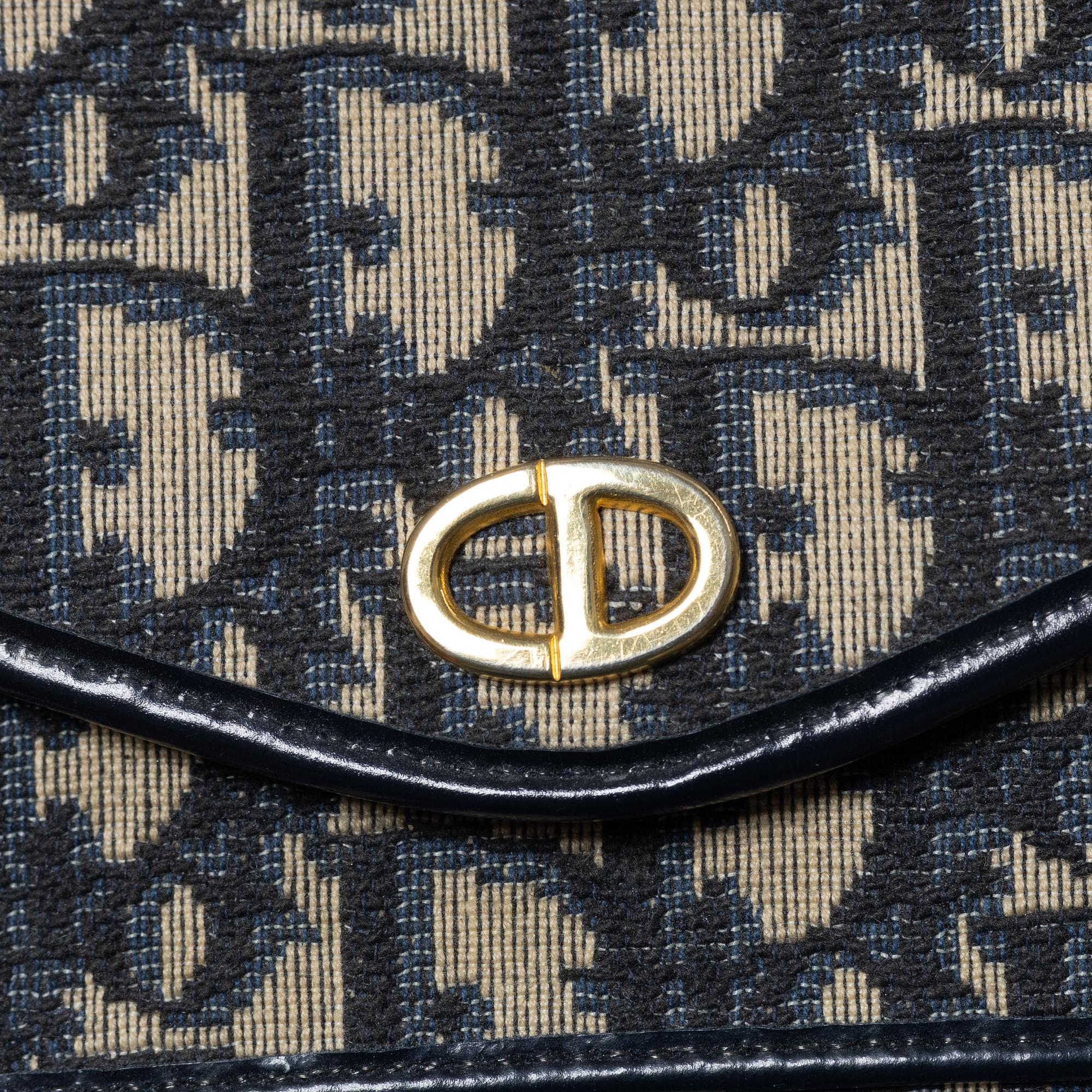 Christian Dior, a clutch and a scarf.