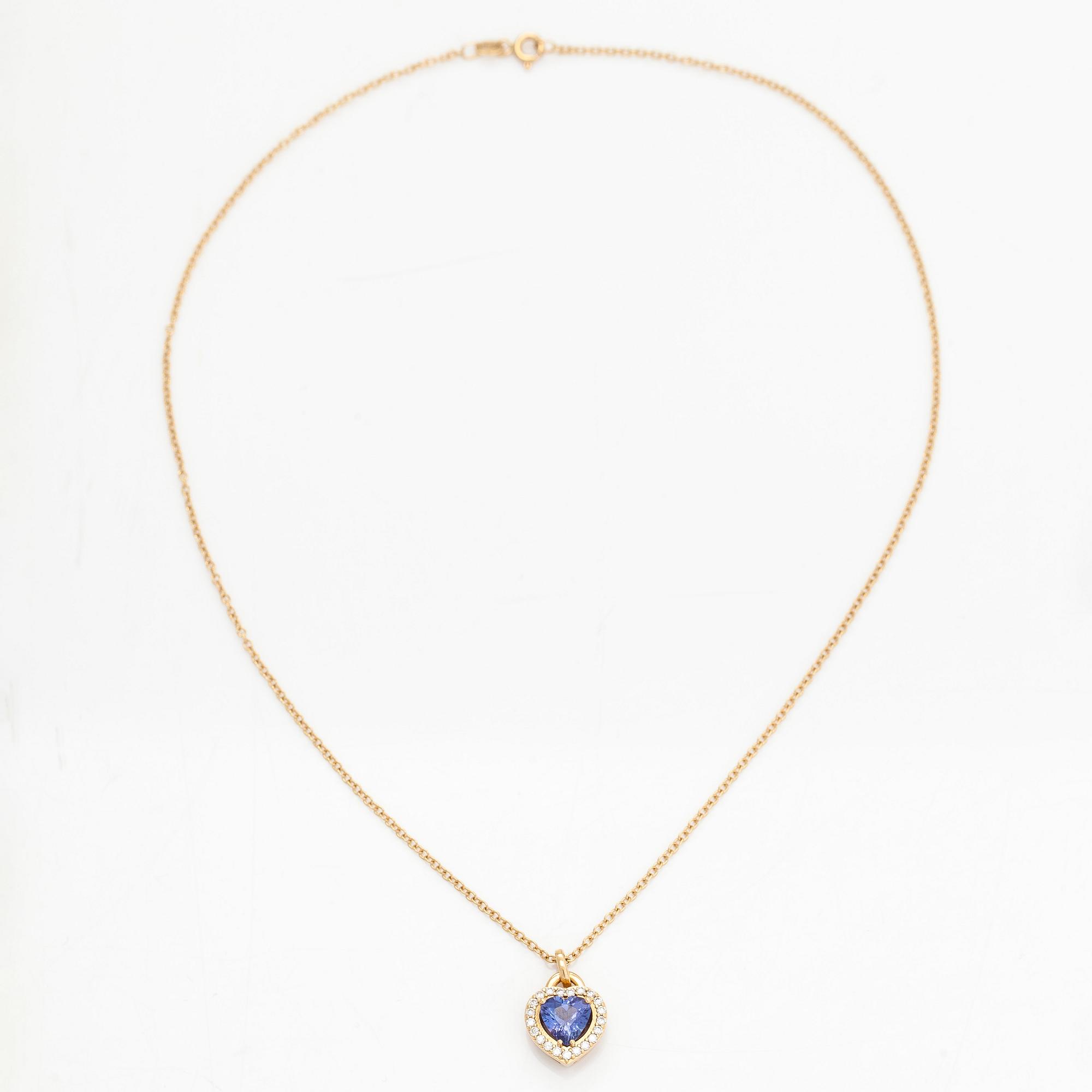 An 18K gold necklace, with a heart-shaped tanzanite and brilliant-cut diamonds.