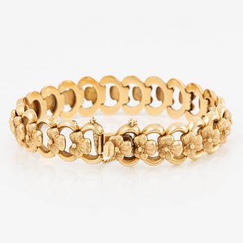 Arm bracelet, 18K gold, decoration of flowers.