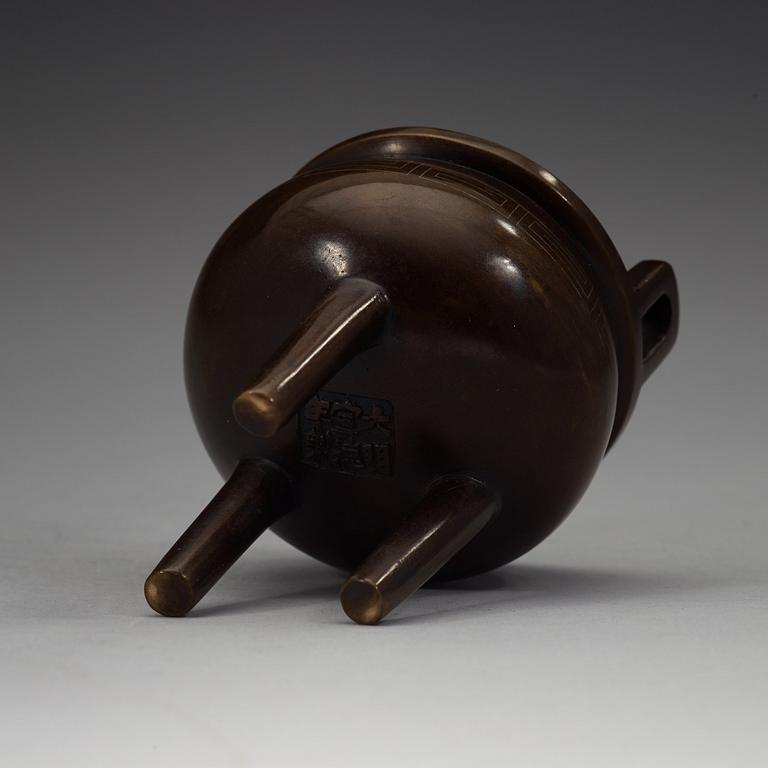 A bronze tripod censer, Qing dynasty, 19th Century with Xuandes six character mark.