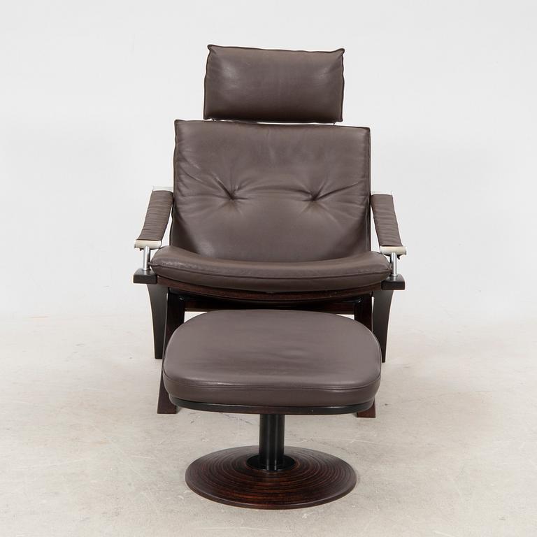 Åke Fribyter, an armchair and fotstool by Nelo, Knislinge, second half of the 20th Century.