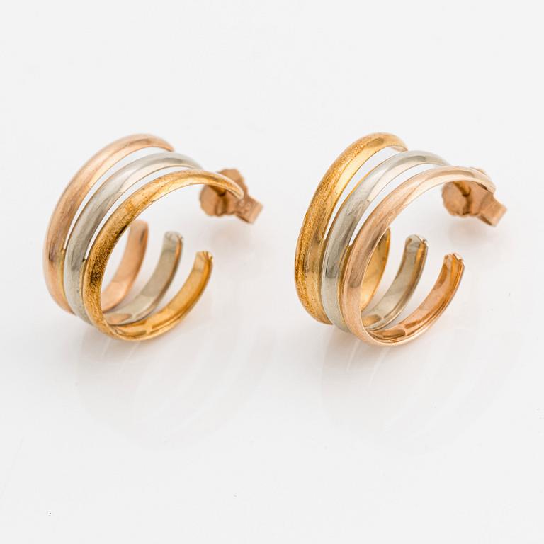 A pair of 18K gold Cartier earrings.