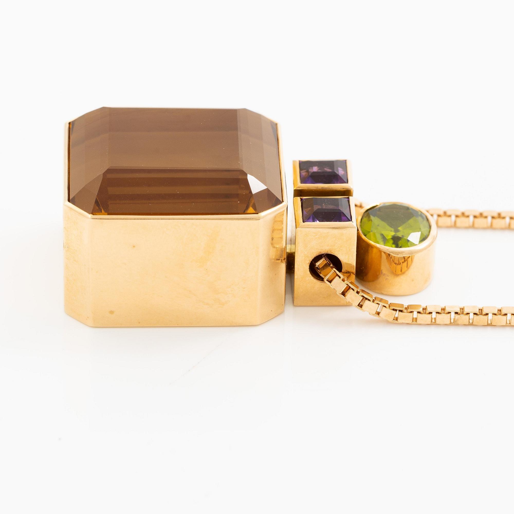 Kristian Nilsson, hänge 18K guld med en fasettslipad citrin, ametist pch peridot. Stockholm, 1986.
