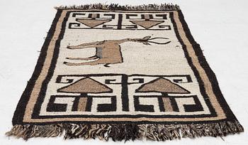 An oriental rug, c. 185 x 100 cm.