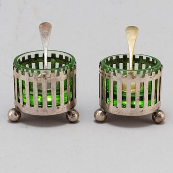 a pair of silver and galss salt cellars by CG Hallberg 1898.