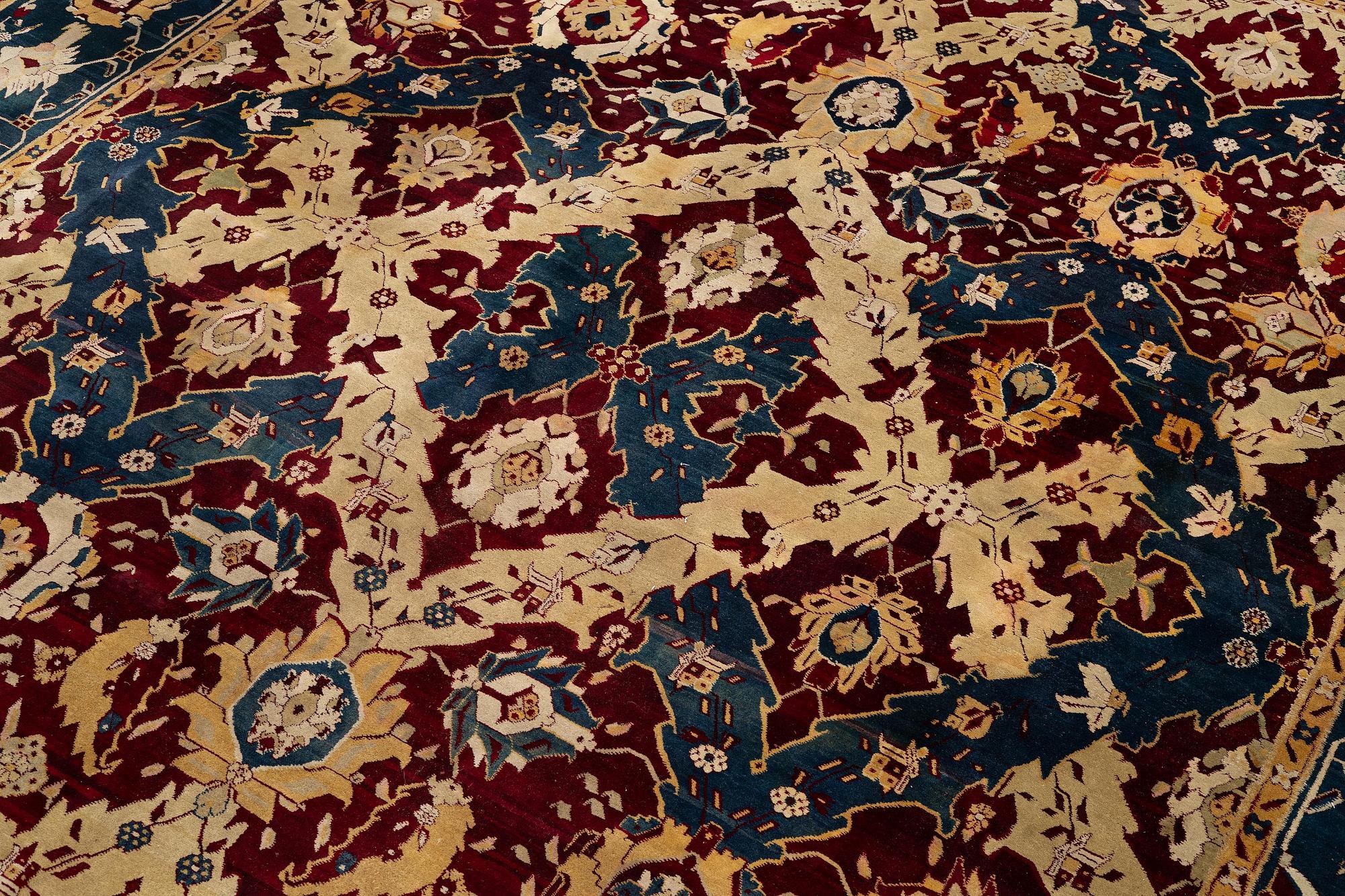 An Antique Agra carpet of 'Dragon Lattice' design, North India, 375 x 298 cm.