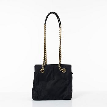 Prada, A black nylon bag.