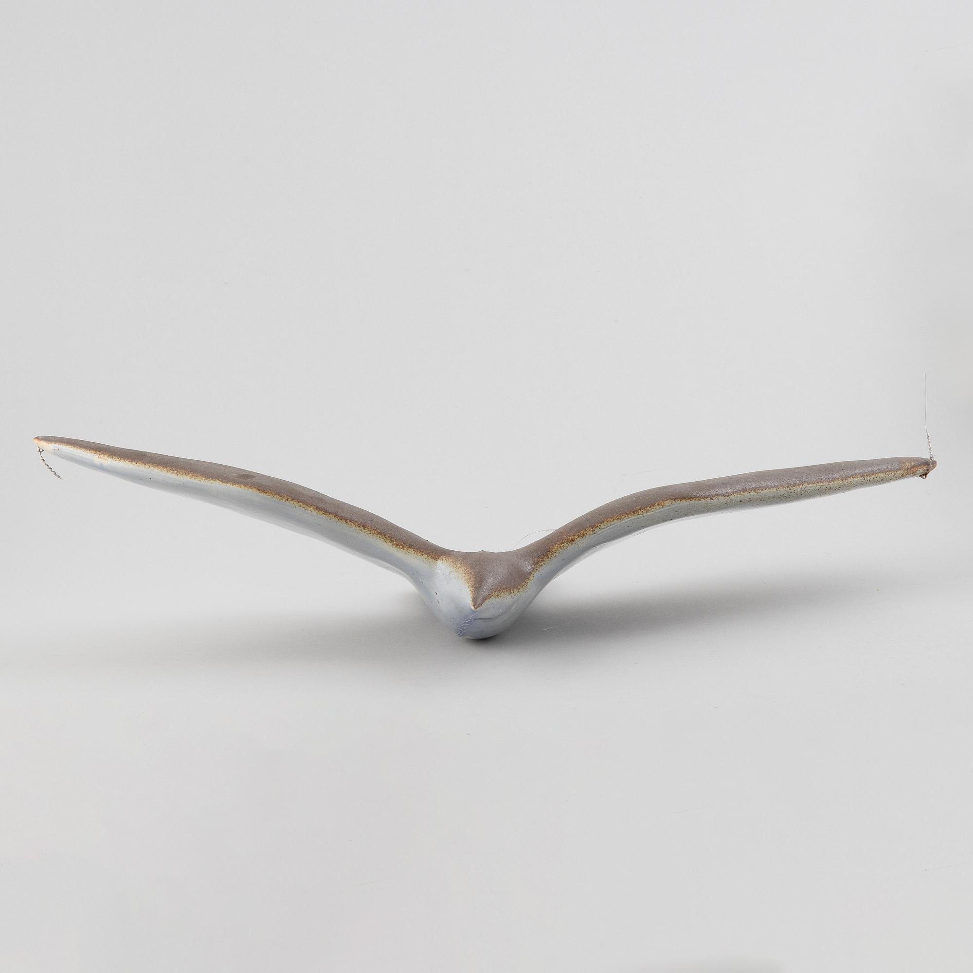 A stoneware sculpture of a sea bird, unsigned.