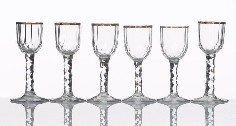 A set of 12 cut and gilded wine glasses, circa 1800.