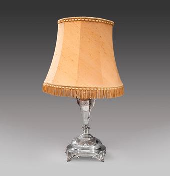 A SILVER TABLE LAMP.
