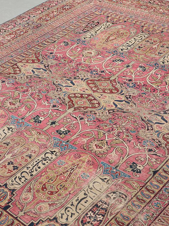 A CARPET, an antique Kerman Laver, ca 363 x 301 cm.