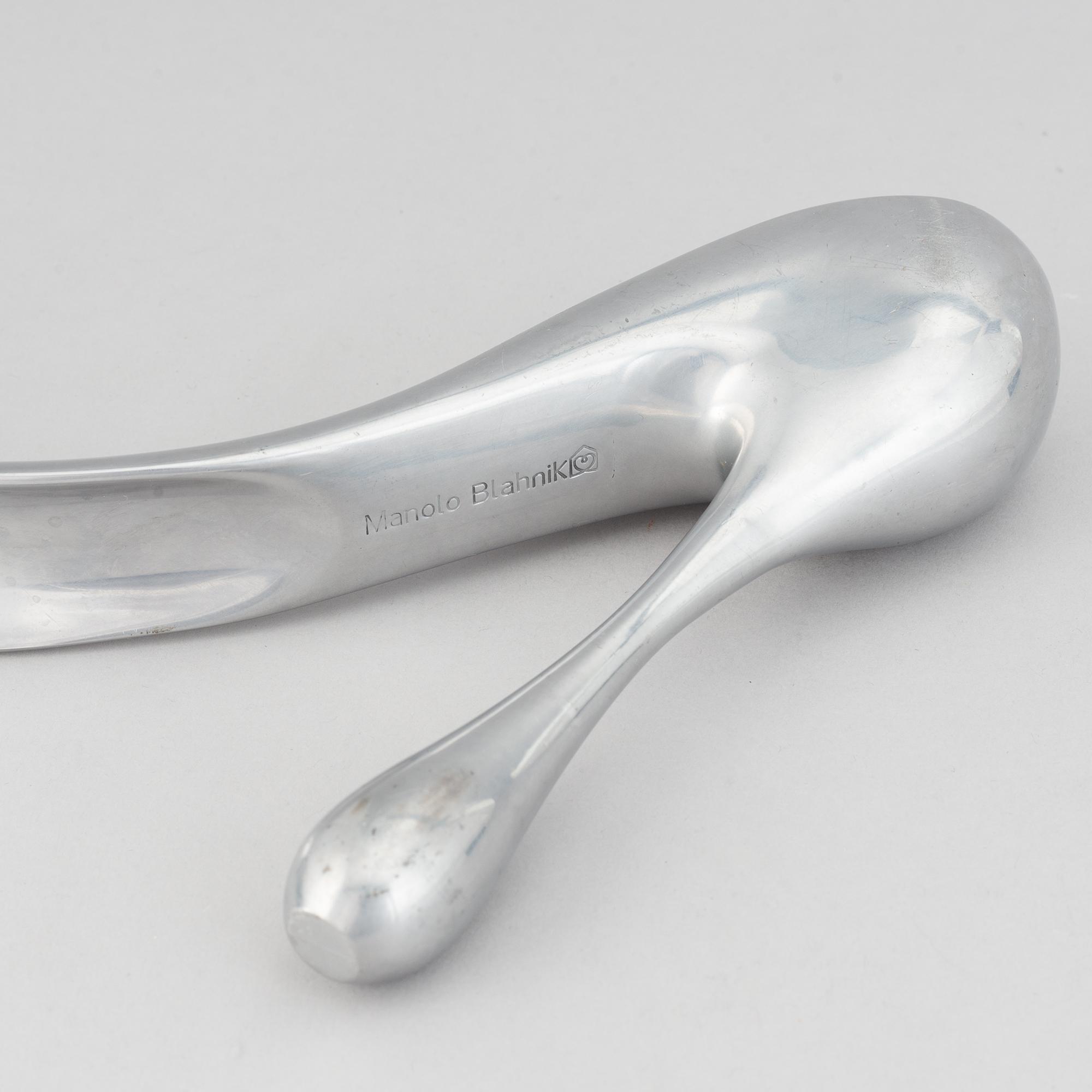 Manolo Blahnik, a metal shoe horn, 21st century.