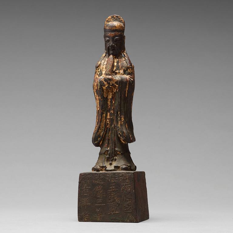 A copper alloy figure of a daoist dignitary, late Ming dynasty (1368-1644).