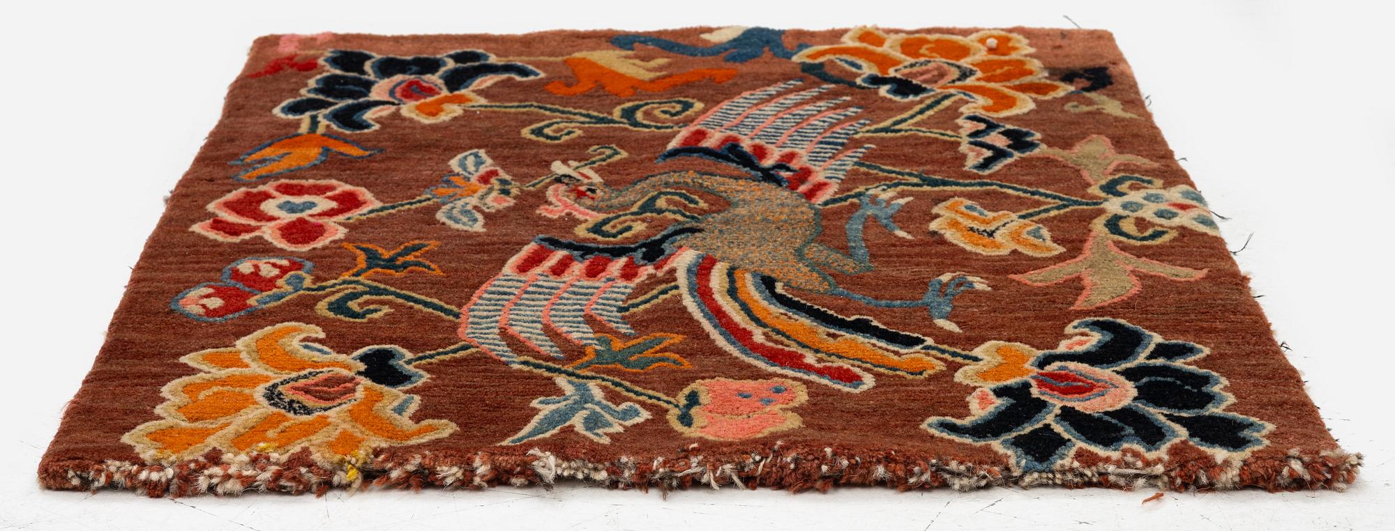 An antique 'Khagangma' rug, Tibet, around 1900. c. 74x63 cm.