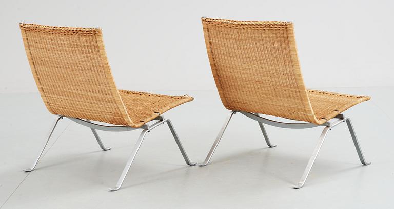 A pair of Poul Kjaerholm 'PK-22' steel and ratten easy chairs, E Kold Christensen, Denmark, maker's mark in the steel.