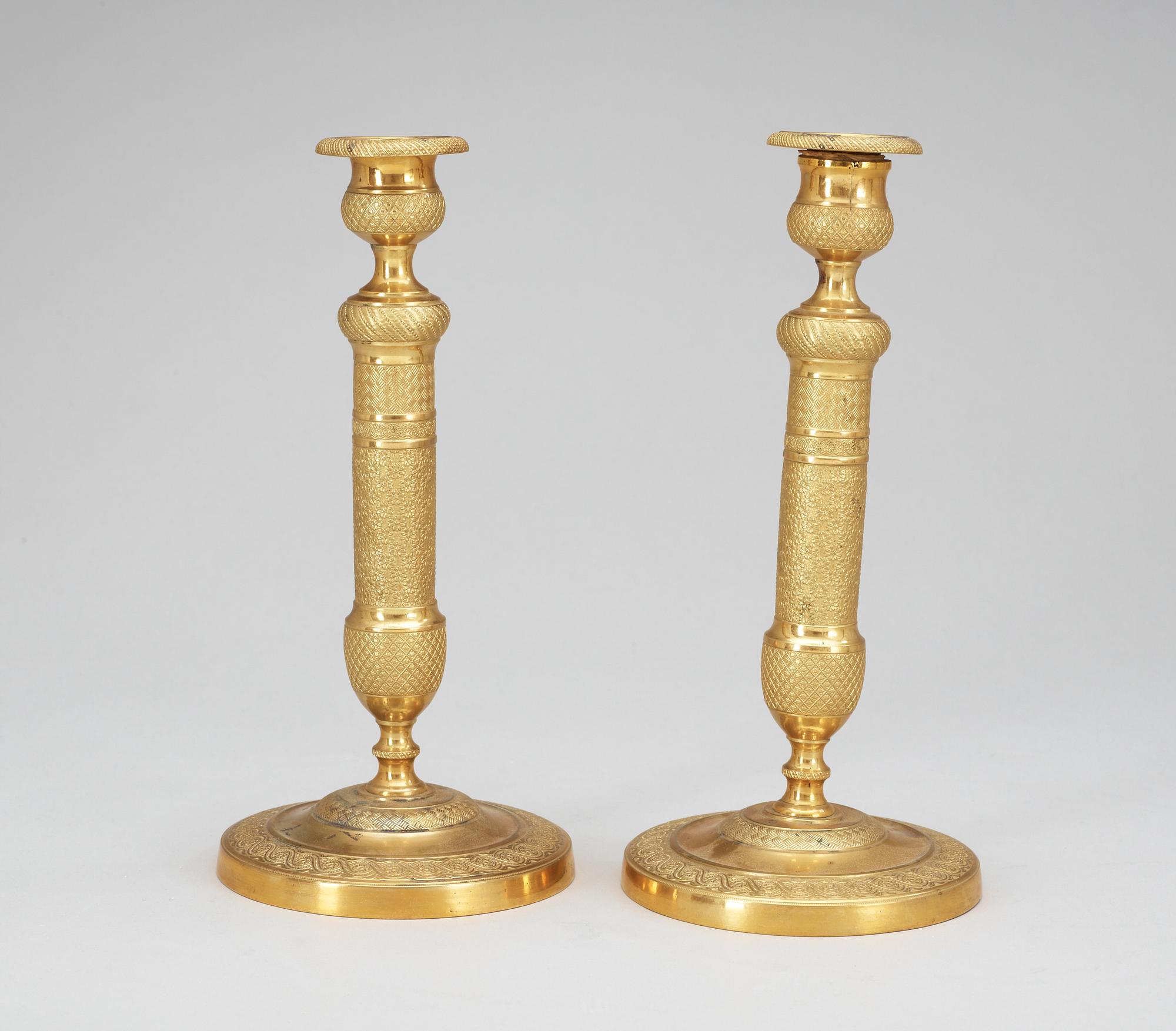 A pair of French Empire early 19th Century candlesticks.