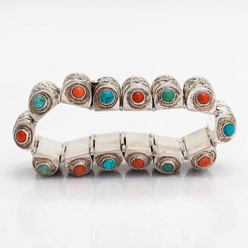 A Chinese silver bracelet with turquoises and corals. Finnish hallmarks 1958.