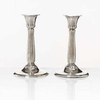 A pair of silver candle sticks, first half of the 20th century.