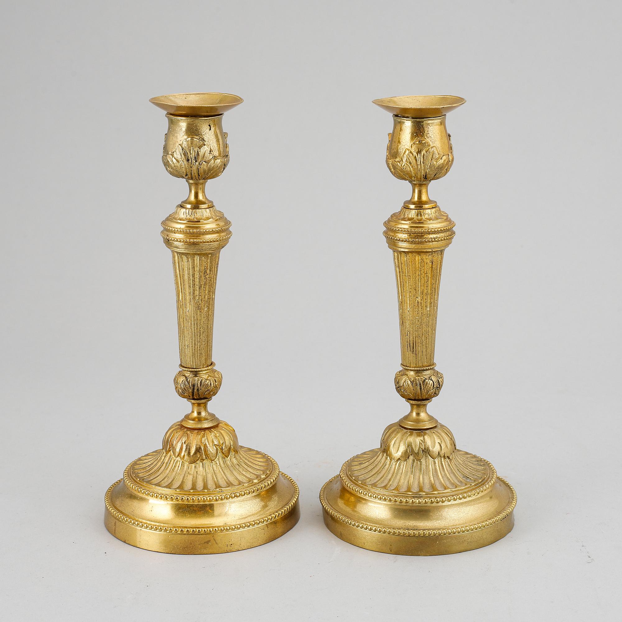 A pair of Louis XVI-style candlesticks, ca 1900.