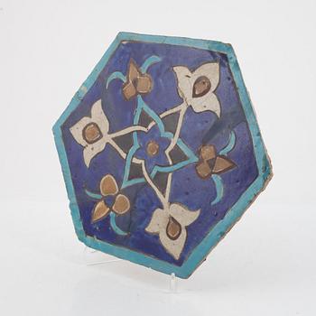 A glazed earthenware tile, Qajar dynasty Persia (Iran), 19th Century.