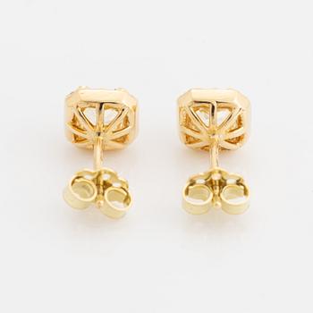 Light yellow diamond earrings.