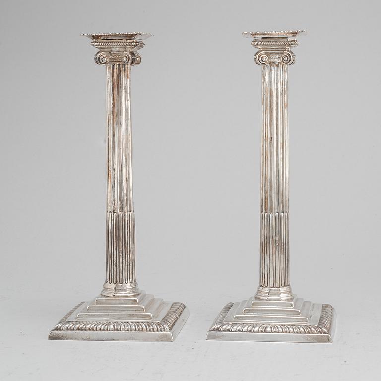 A pair of English 18th century silver candlesticks, worn marks, London.