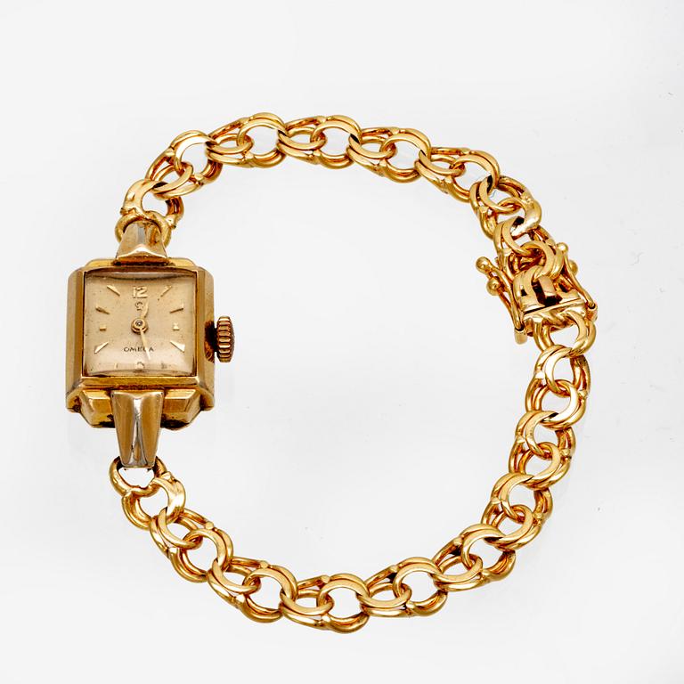 An 18 K gold wrist watch, Omega. Toral weight incl the watch 16 grams.