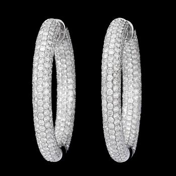 127. A pair of diamond, 8.52 cts in total, hoop earrings.