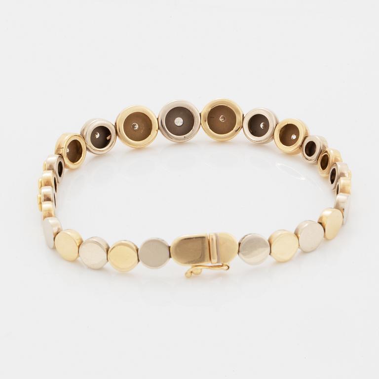 A 14K gold bracelet set with round brilliant-cut diamonds.