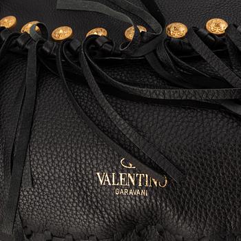 Valentino, a black leather hobo bag.