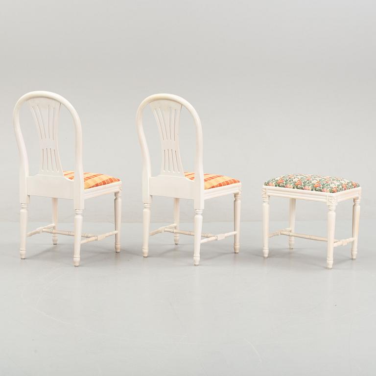 A dining table with eight chairs and a stool, Gustavian style, second half of the 20th Century.