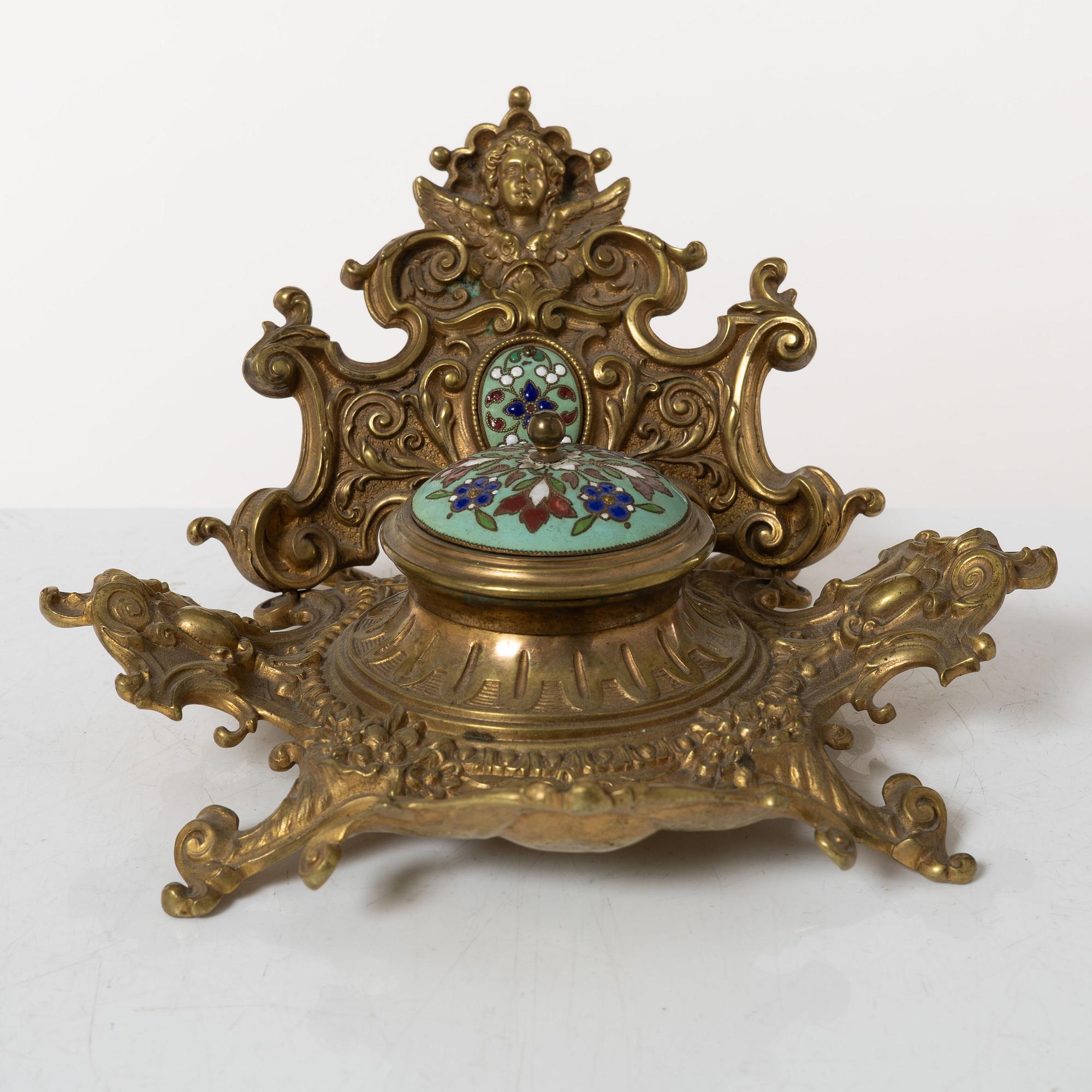 A pair candlesticks and an inkwell, circa 1900.