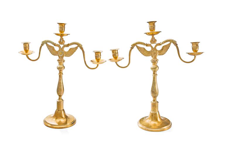 A pair of three light bronze candelabras made by Leander Helander, Tilvik, Kalajoki, Finland.