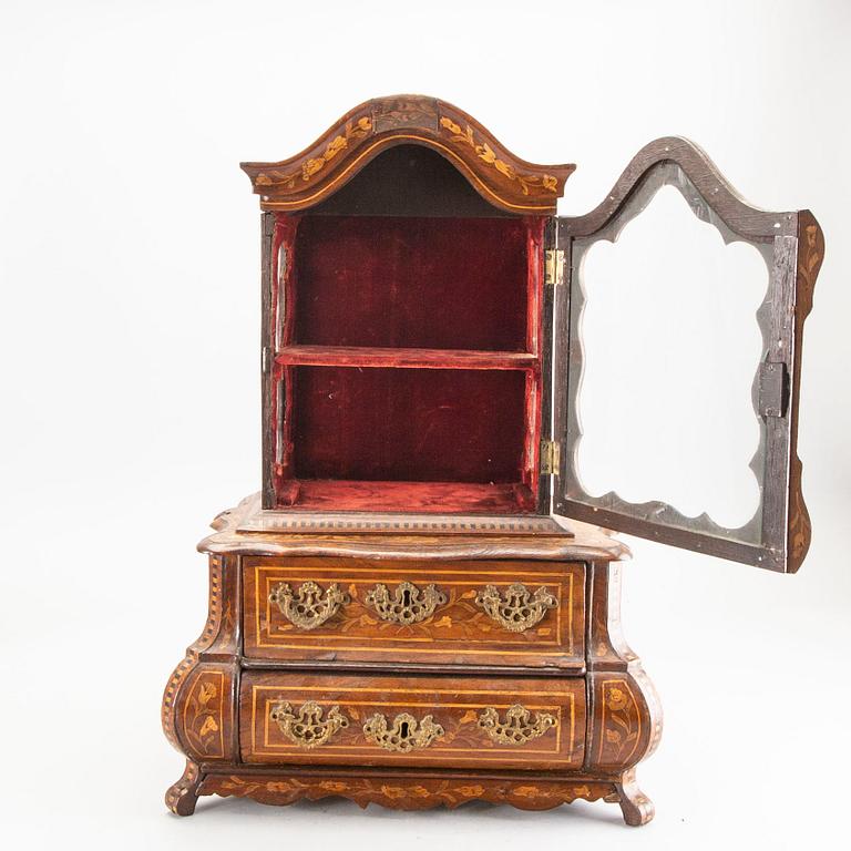 A Louis XV-style miniature cabinet around 1900.
