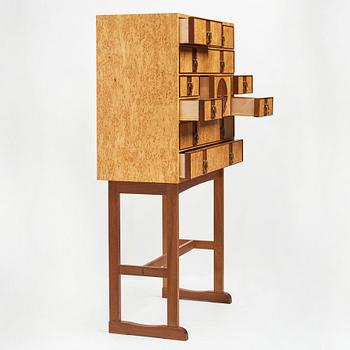 Josef Frank, a birch burrwood and padouck cabinet on stand, model 2215, Svenskt Tenn Sweden probably 1960-70's.