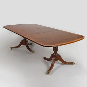 A 20th Century Regency style mahogany dining table.