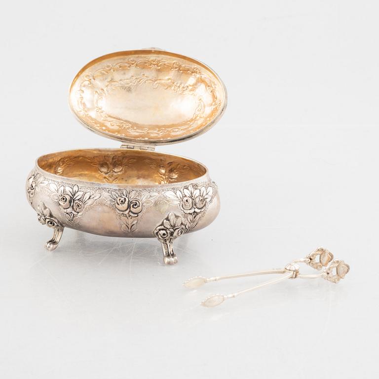 Sugar box, silver 830, Swedish import mark, and sugar tongs, sterling silver, Georg Jensen, Denmark.