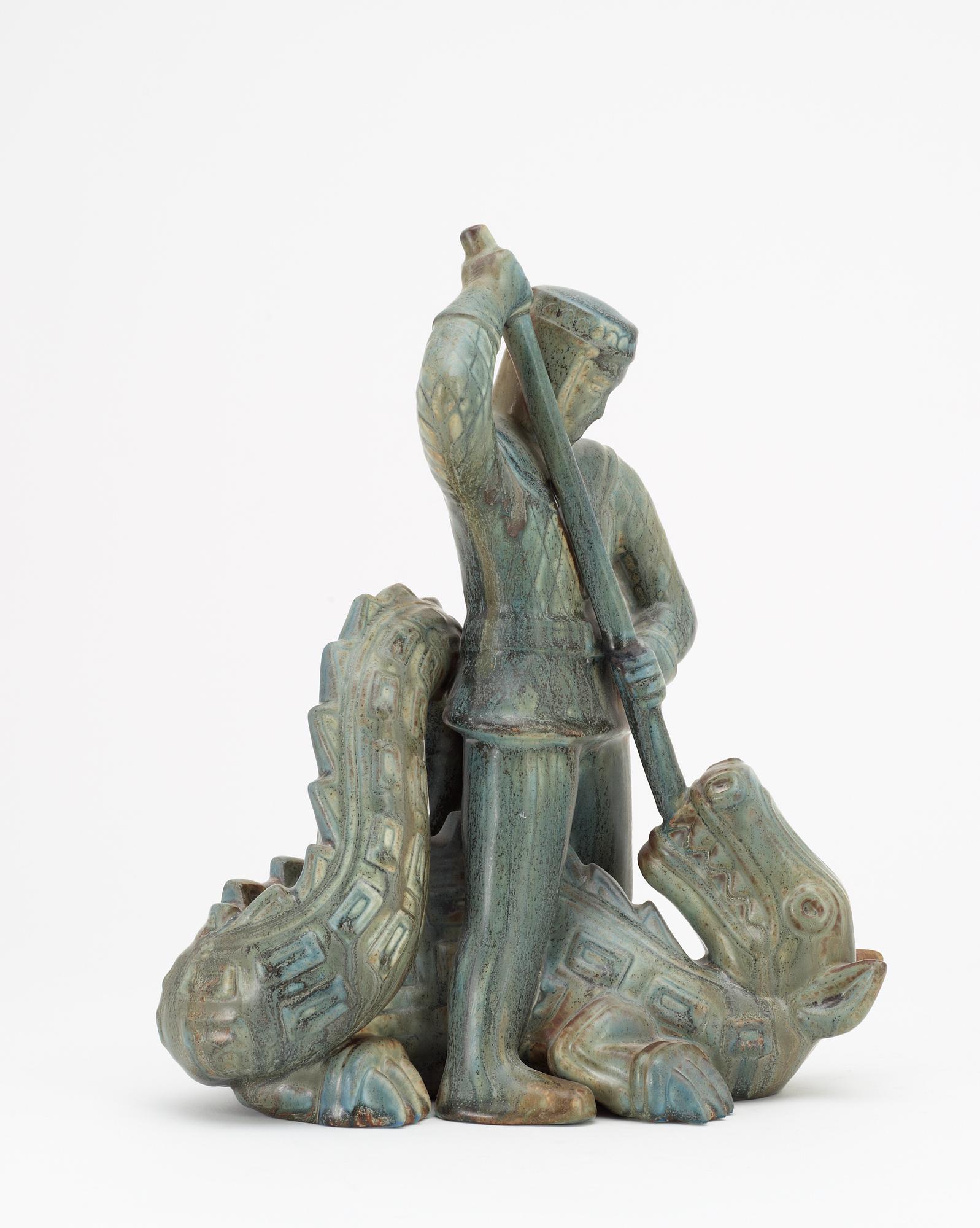 A Gunnar Nylund stoneware sculpture of S:t Michael and the dragon, Rörstrand.