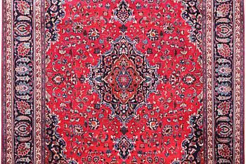 A Kashan carpet, signed, c. 358 x 244 cm.