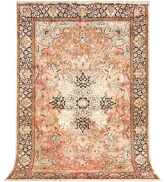 A silk Kashmar carpet, c. 280 x 177 cm.