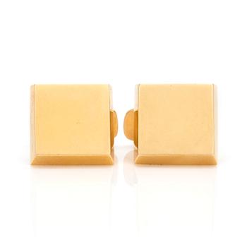 A pair of 18K gold cuff-links.