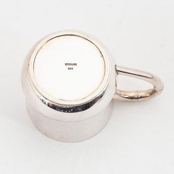 Six parcel-gilt sterling silver jugs.