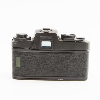 Leica R4s camera body, lens, and accessories.