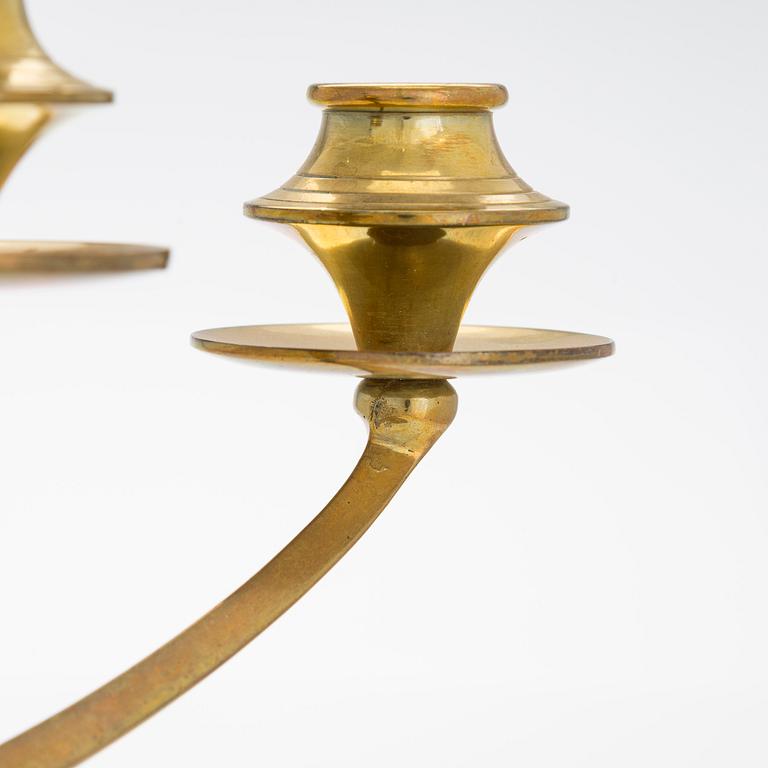 A Jugend brass candlelabra, early 20th century,