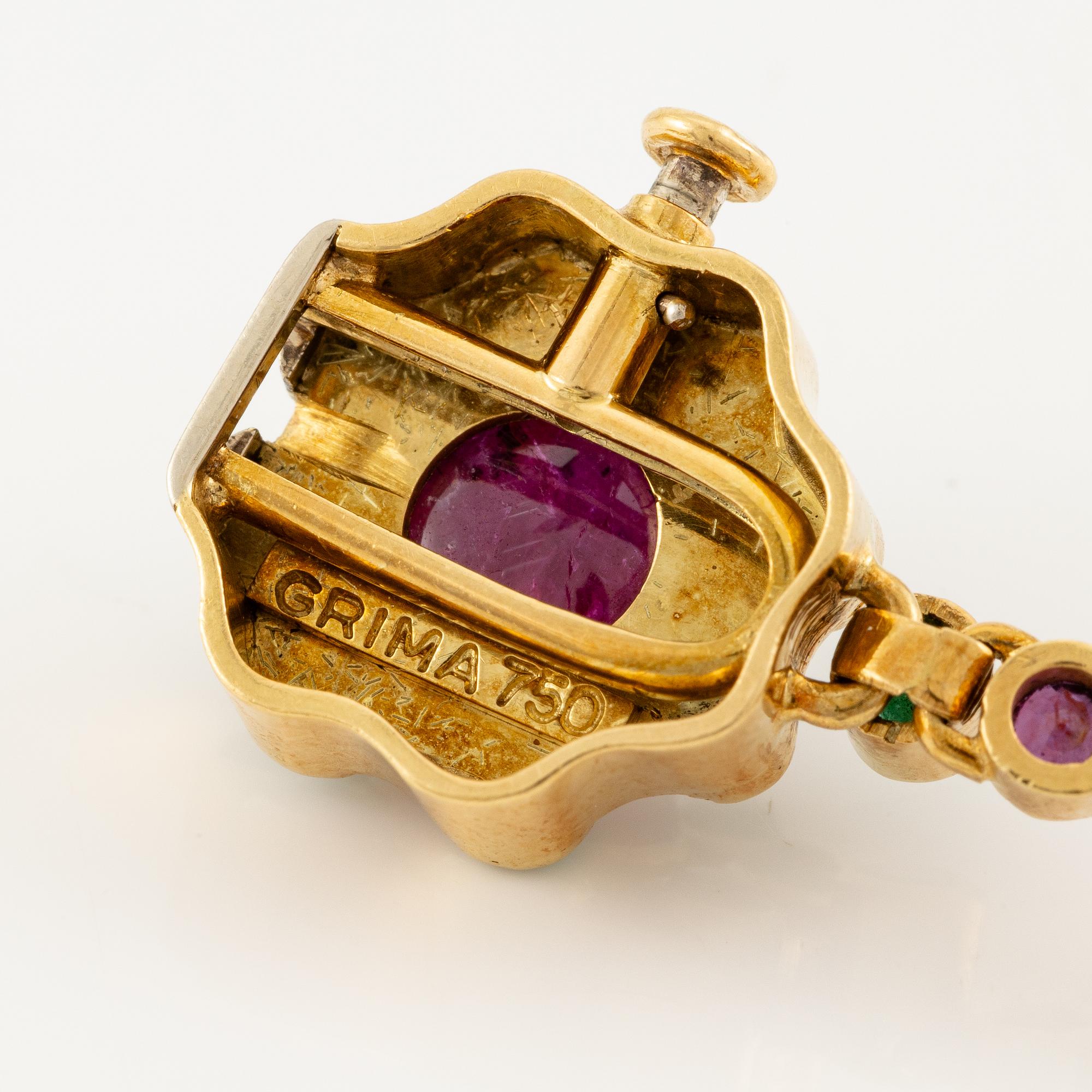 Andrew Grima, collier 18K guld med runda briljantslipade diamanter samt rubiner och smaragder.